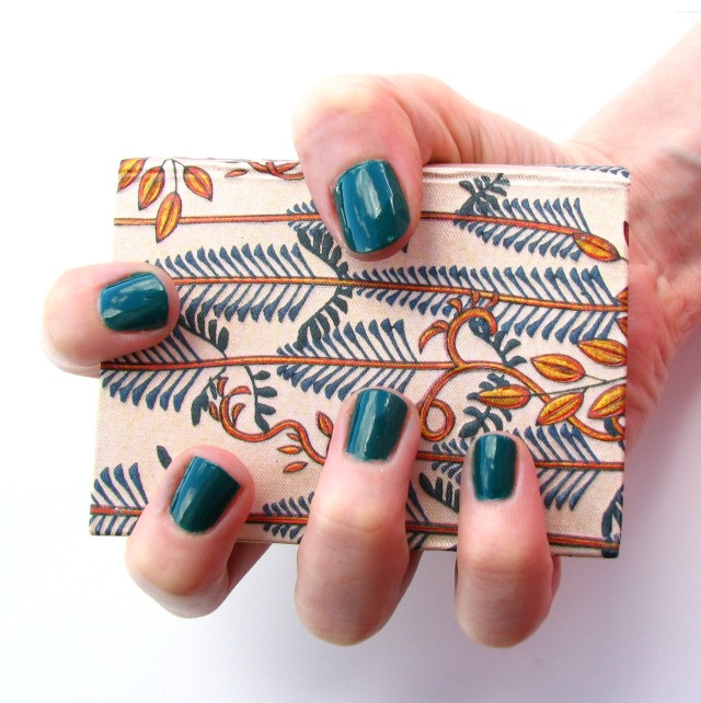 I was at a bit of a loss for jungle-y things to photograph with this manicure, but I think the design on the cover of this little book is perfect! It may or may not contain spells for getting rid of minor skin afflictions - you'll have to ask the wizard.
